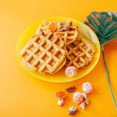 Traditional belgian waffles with fresh fruit and nuts. Orange.