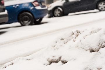 Car on winter road covered with snow. Vehicle at snowfall
