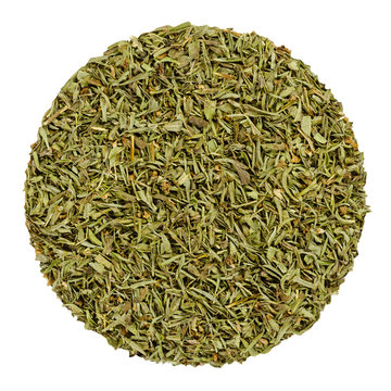 Dried savory. Herb circle from above isolated over white. Disc made of chopped summer savory, Satureja hortensis, a green herb and seasoning for barbecues, stews and sauces. Closeup. Macro food photo.