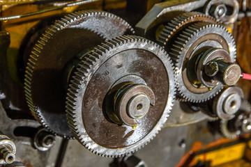 Gear metal wheels in industrial machine close-up