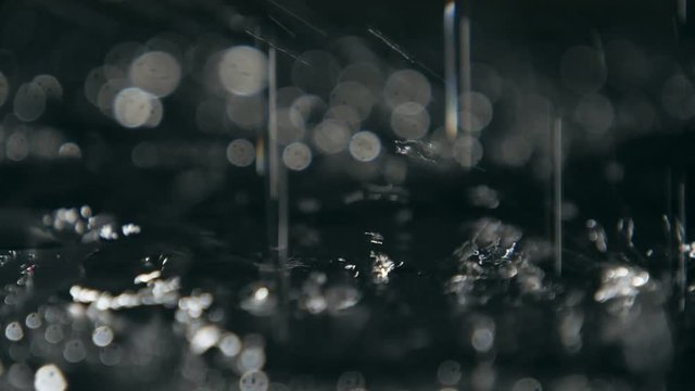 Magic dots of wet water covering cave surface with sparkling dots in slo-mo  