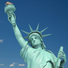 Fototapeta premium Statue of Liberty in New York City, USA on the sky background.