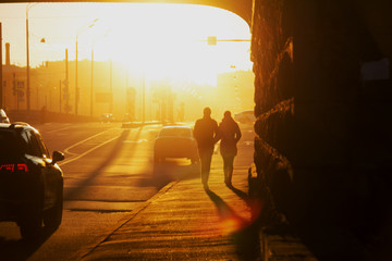 silhouettes of people on background of sky