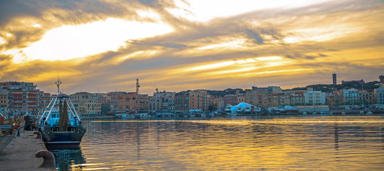 Evening view of the port of Anzio sunset in fiery color
