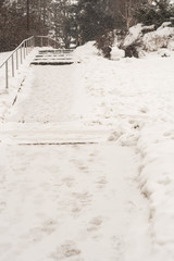 Snow in the city. Winter snow fall landscape. Street covered with snow and ice. Road in winter time. Cold concept.