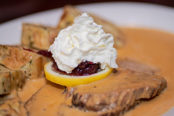 Beef sirloin, Slow roast bacon infused beef with traditional cream sauce, homemade bread dumplings, bacon and savory herbs.