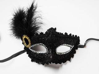 Black carnival mask on white background