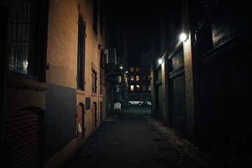 Fototapeta na wymiar dark street. urban slums at night