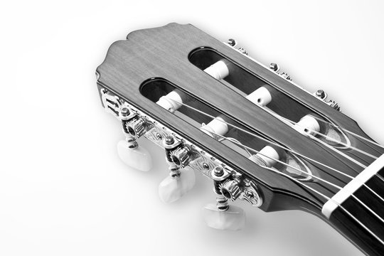 Detail of a golden shovel of a professional classical guitar