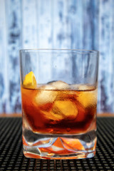 Negroni cocktail in old fashioned glass with orange slice