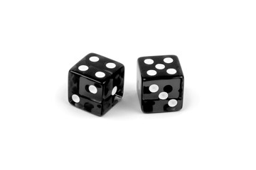 Two black glass dice isolated on white background. Four and five.