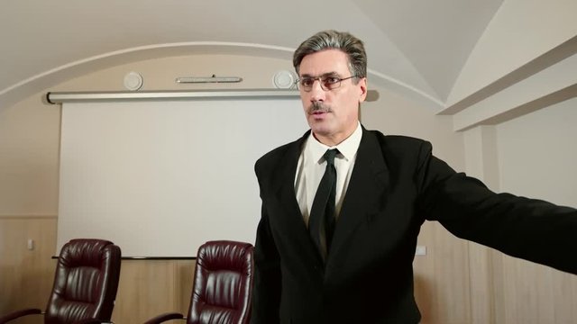 Politician refuses to give an interview to the journalist, no comment. Closes the camera by hand.