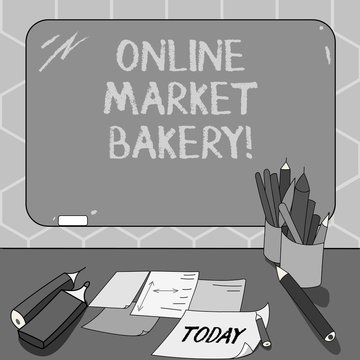 Text sign showing Online Market Bakery. Conceptual photo Produces and sells flourbased food baked in oven Mounted Blank Color Blackboard with Chalk and Writing Tools Sheets on Desk