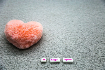 Pink heart on the gray background