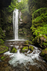 Fototapeta na wymiar Highest waterfall in the rock grotto