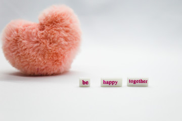 Pink heart on the white background