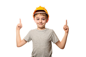 Boy in orange construction helmet shows forefingers to the top. Portrait. Isolate on white background.