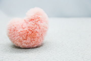 Pink heart on the white background
