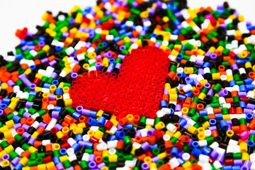 Red heart of red constructor on a constructor background