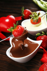 Valentine Chocolate fondue melted with fresh strawberries and dark and white chocolate. Tublips and sugar hearts.