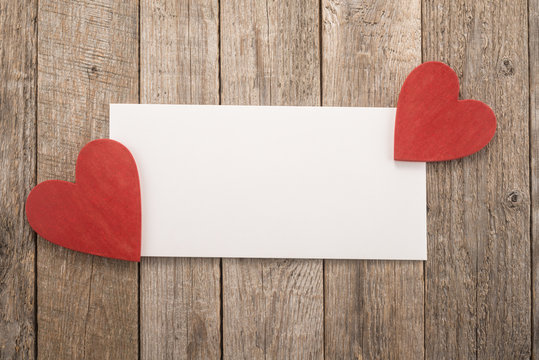 White paper and red hearts 