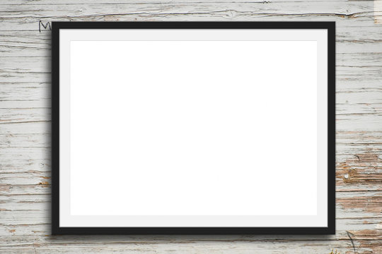 black picture frame on vintage wood background - blank mock-up