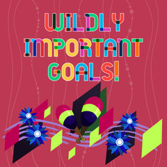 Obraz premium Handwriting text writing Wildly Important Goals. Concept meaning most important objective that needs special attention Colorful Instrument Maracas Handmade Flowers and Curved Musical Staff