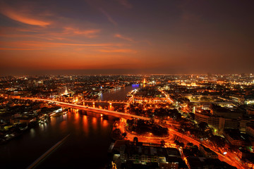 Fototapeta premium City Scape, Panorama of Chao Praya River. River view overlooking the Phra Phuttha Yodfa Bridge or Memorial Bridge and Wat Arun with grand Palace in the background, Bangkok Thailand. 26 January 2019