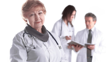 Fototapeta premium adult female doctor therapist on blurred background of colleagues