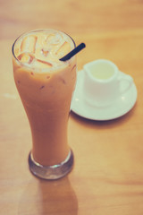 Thai Iced Milk Tea with sugar syrup on the side