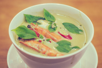 thai Green Curry with Prawns in a white porcelain bowl