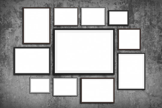 photo frame wall mock up - set of picture frames on vintage wall background -