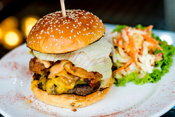Texan Burger, Sweet pickles, fried onions, maple grilled bacon, cheddar cheese, grilled beef patty and Texan BBQ mayo