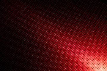 White ray of light on a red background to the point turning into blackout