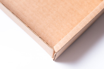 Cardboard box on wooden background