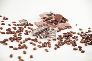 close up.set of chocolate bars and coffee beans. isolated on white.photo with copy space