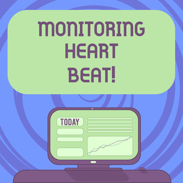 Text sign showing Monitoring Heart Beat. Conceptual photo Measure or record the heart rate in real time Mounted Computer Screen with Line Graph on Desk Blank Color Text Box