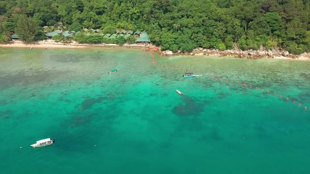 Aerial view of crystal clear waters and rocky shore at Perhentian Islands (Pulau Perhentian)