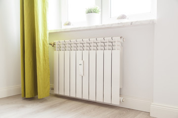 Heating white radiator radiator in living room.