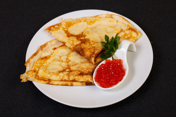 Pancake with red caviar