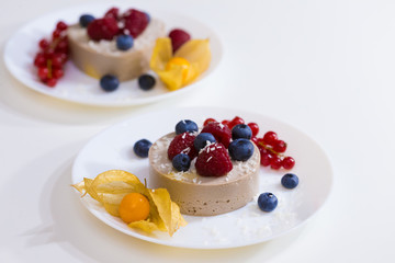 Food. Souffle, raspberries, blueberries, physalis