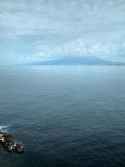 Blue sea and sky and coast with stones