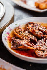 Sichuan street food spicy rabbit head cut in half in a plate