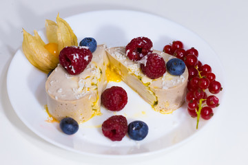 Food. Souffle, raspberries, blueberries, physalis
