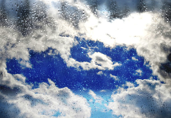 beautiful blue sky with clouds and raindrops