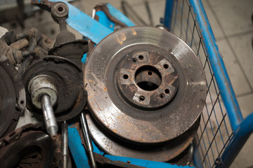 Worn out rusty brake discs and other parts - Image