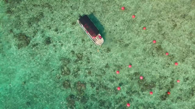 Aerial view of a boat and crystal clear waters at Perhentian Islands (Pulau Perhentian)