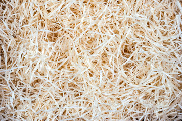 Wood background. Close-up of wooden shavings for packing.