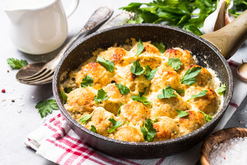 Meatballs in cream sauce with parmesan cheese.