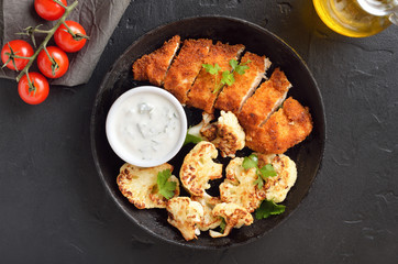 Chicken breast, sauce and fried cauliflower